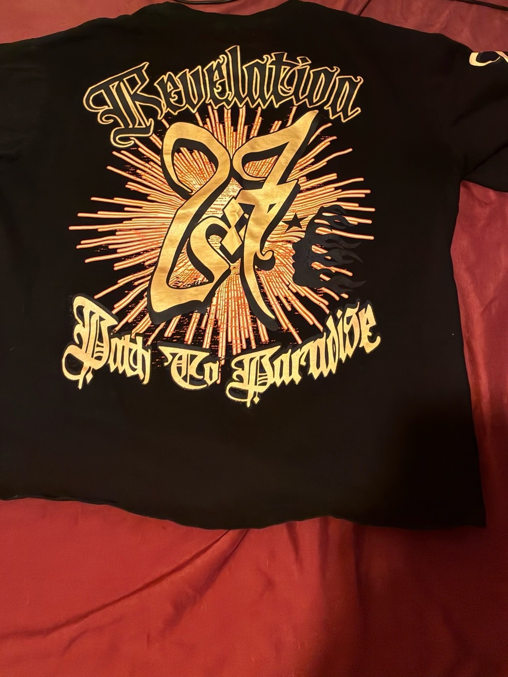 Men's Black Short-Sleeve Graphic Tee with Gold Sunburst Design